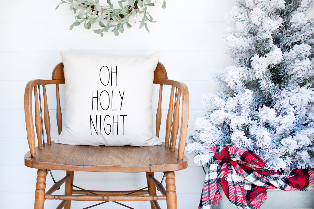oh holy night pillow on a chair
