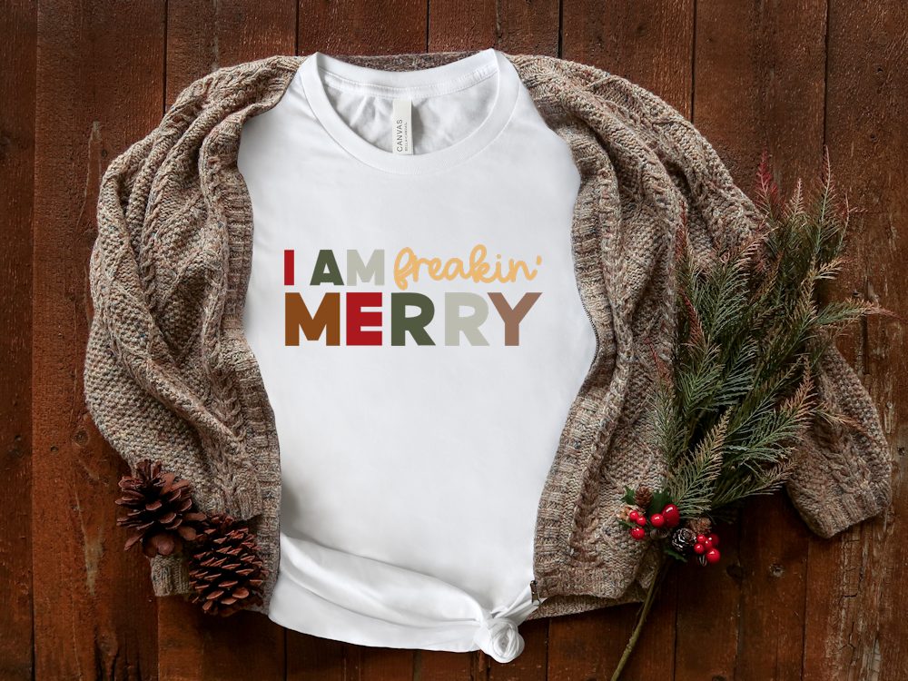 White shirt with "I am Freakin Merry" saying