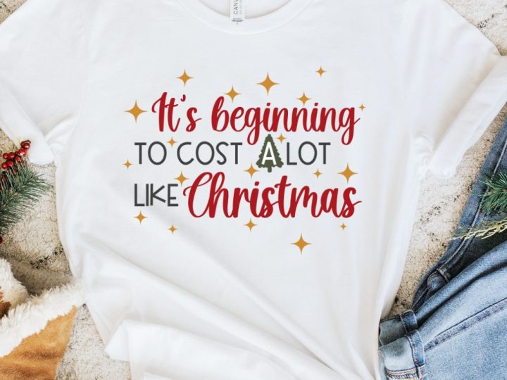 white shirt with funny christmas svg design that says it's beginning to cost a lot like christmas